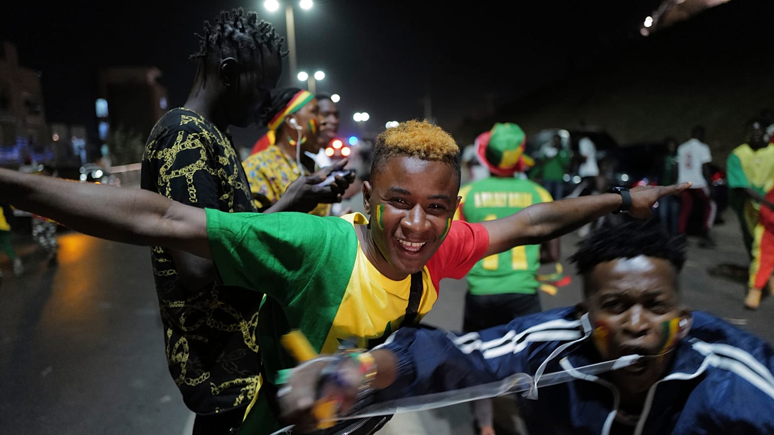 Senegal fans in Dakar celebrate their team's victory against Egypt in the African Cup of Nations soccer final played in Yaounde, Cameroon on Sunday, Feb. 6, 2022.