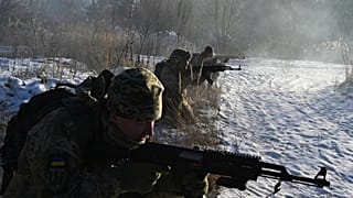 Ukrainian Territorial Defense Forces, the military reserve of the Ukrainian Armes Forces, take part in a military exercise near Kiev on December 25, 2021.