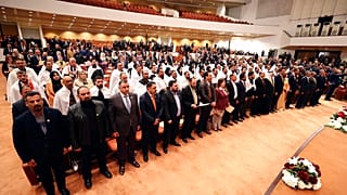 صورة أرشيفية للمشرعين العراقيين المنتخبين حديثاً في افتتاح الجلسة الأولى للبرلمان ببغداد 9 يناير 2022