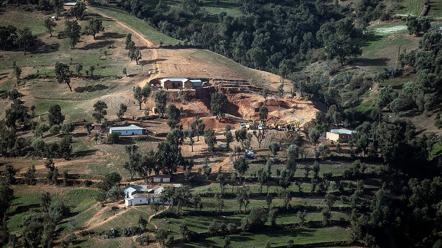 A view of the village of Ighran and the hill in which the rescue mission of 5-year-old Rayan had been taking place after he was stuck for several days