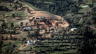 A view of the village of Ighran and the hill in which the rescue mission of 5-year-old Rayan had been taking place after he was stuck for several days