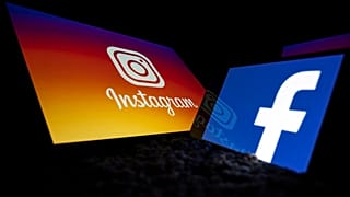 Logos of US social networks Facebook and Instagram on the screens of a tablet and a mobile phone.