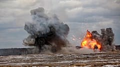 In this photo taken from video and released by Moscow on Feb. 4, 2022, flame and smoke rise during joint Russia-Belarus military drills at Brestsky firing range, Belarus