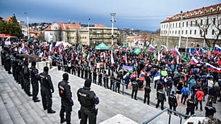 Protesters gathered in front of the parliament during the debate on the new Defense Cooperation Agreement.