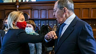 In this handout photo released by Russian Foreign Ministry, British and Russian foreign ministers Liz Truss and Sergei Lavrov greet each other in Moscow, Feb. 10, 2022.