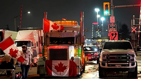 Truckers and supporters block access from the Ambassador Bridge, linking Detroit and Windsor, in protests against COVID vaccine mandates and restrictions. Feb. 9, 2022.