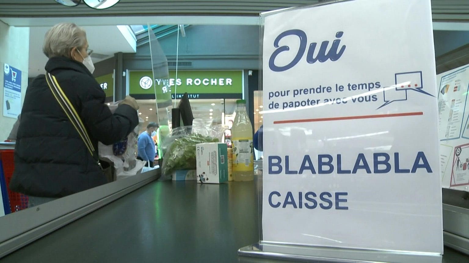 Consumers shop at Carrefour supermarket in Langueux, western France, on January 29, 2022.