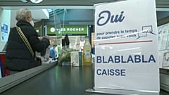 Consumers shop at Carrefour supermarket in Langueux, western France, on January 29, 2022.