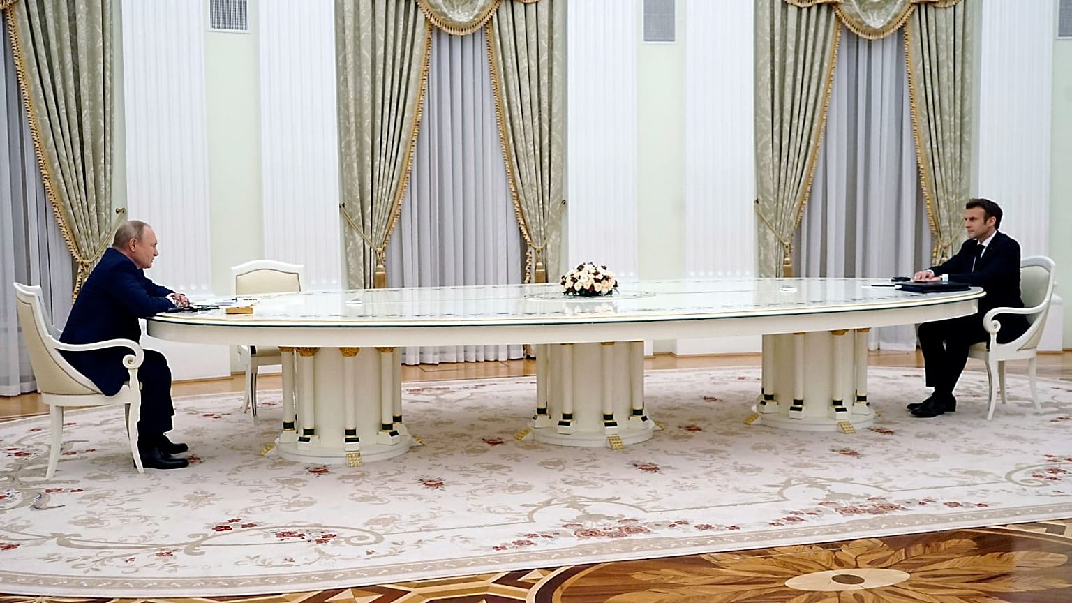 Russian President Vladimir Putin and French President Emmanuel Macron were separated by a six-metre long table.