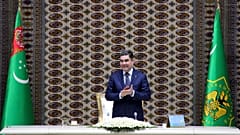 Turkmenistan's President Gurbanguly Berdymukhamedov applauds as he attends an opening ceremony of a chemical plant in 2018
