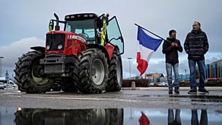Protesters prepare to leave for a convoy in Lyon, central France, Friday, 11 February, 2022