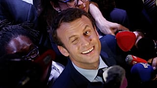 hen Independent centrist presidential candidate Emmanuel Macron smiles to the media after a meeting with young people of Paris suburbs in 2017