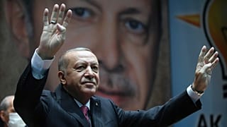 Turkey's President Recep Tayyip Erdogan gestures as he addresses his party members, in Ankara in 2020