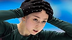 Kamila Valieva, of the Russian Olympic Committee, puts her hands on her head during a training session at the 2022 Winter Olympics