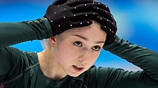 Kamila Valieva, of the Russian Olympic Committee, puts her hands on her head during a training session at the 2022 Winter Olympics