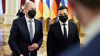 This handout picture taken and released by the Ukrainian presidential press-service shows President Volodymyr Zelensky (R) welcoming German Chancellor Olaf Scholz