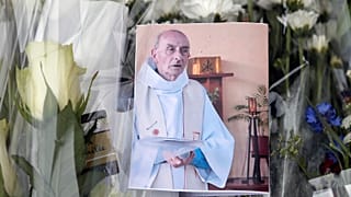A picture of late Father Jacques Hamel at the makeshift memorial in Saint-Etienne-du-Rouvray, Normandy, France, July 27, 2016.