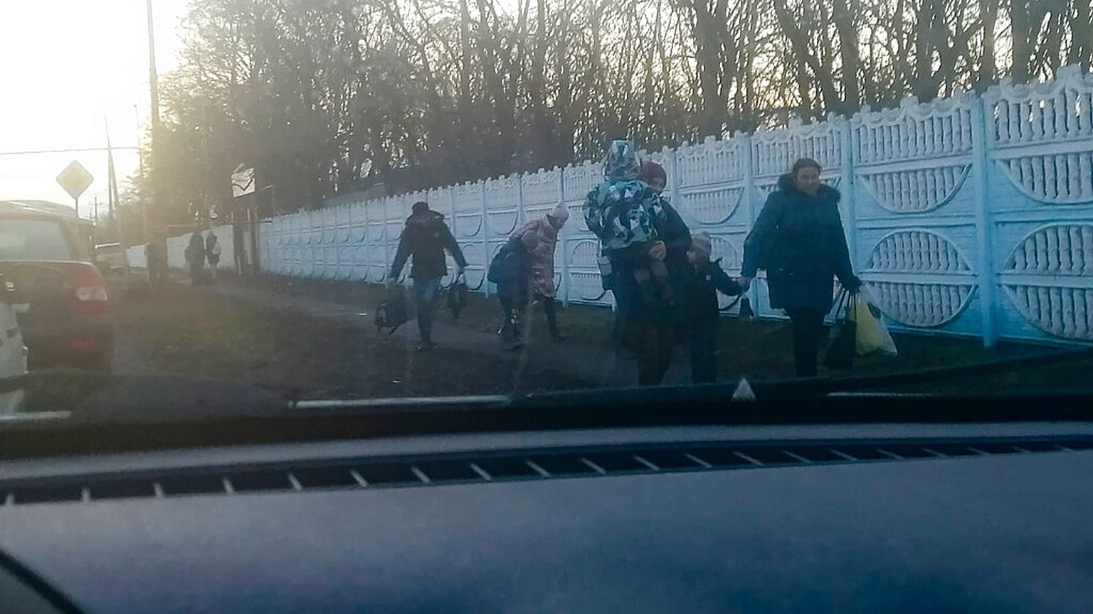 People walk from a bus after evacuating from Donetsk, the territory controlled by pro-Russian militants in eastern Ukraine