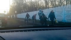People walk from a bus after evacuating from Donetsk, the territory controlled by pro-Russian militants in eastern Ukraine