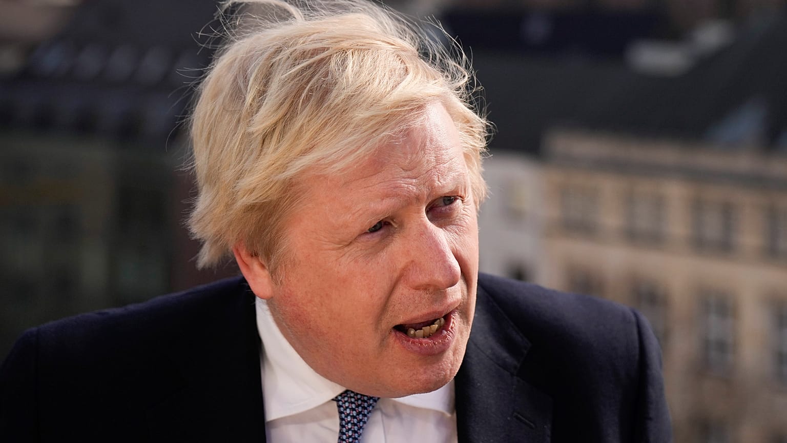 Britain's Prime Minister Boris Johnson briefs the media during the Munich Security Conference in Munich, Germany, Saturday, Feb. 19, 2022. 