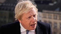 Britain's Prime Minister Boris Johnson briefs the media during the Munich Security Conference in Munich, Germany, Saturday, Feb. 19, 2022. 