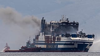 Smoke rises from the Italian-flagged Euroferry Olympia, which is on fire for third day, in the Ionian sea near the Greek island of Corfu, on Sunday, Feb. 20, 2022.