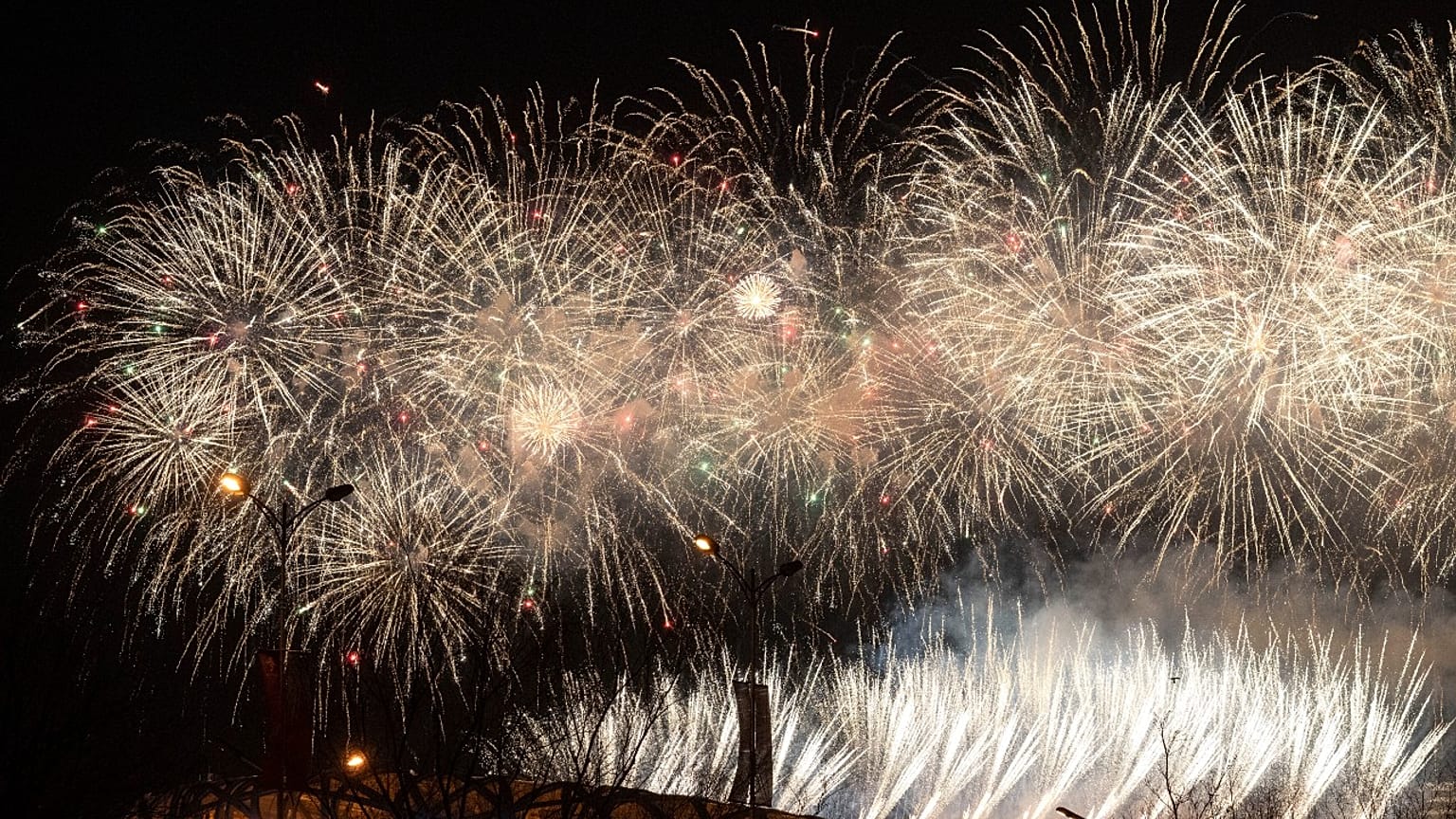 Fireworks explode during the closing ceremony of the 2022 Winter Olympics, Sunday, Feb. 20, 2022, in Beijing.