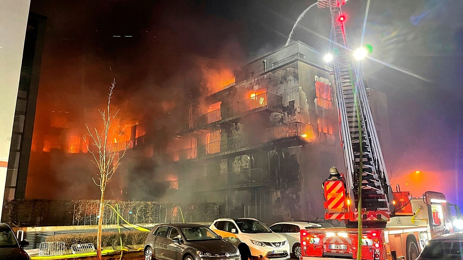 Firefighters battle a fire at residential complex in Essen Germany, Feb. 21, 2022. 