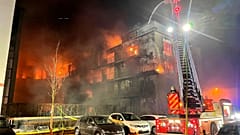 Firefighters battle a fire at residential complex in Essen Germany, Feb. 21, 2022. 