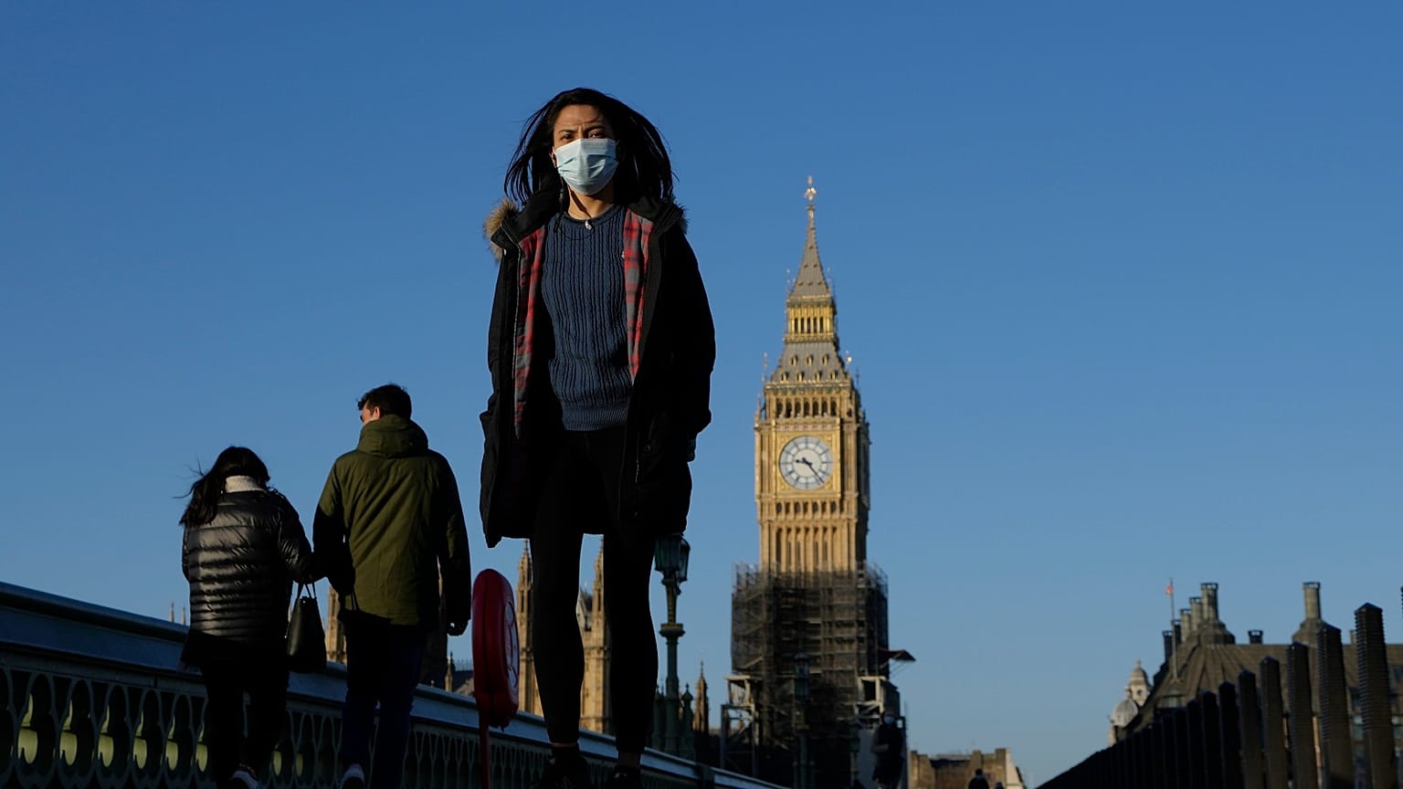 Shoppers walk down Oxford Street, Europe's busiest shopping street, in London, Dec. 23, 2021.