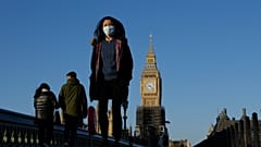 Shoppers walk down Oxford Street, Europe's busiest shopping street, in London, Dec. 23, 2021.