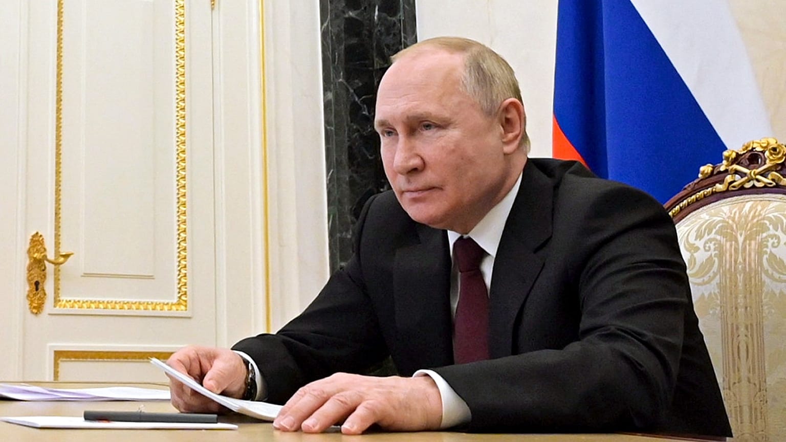 Russian President Vladimir Putin talks via videoconference, February 21, 2022.
