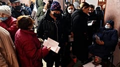 People from Donetsk gather to fill in documents after evacuating in the Rostov-on-Don region, near the border with Ukraine, Russia, Sunday, Feb. 20, 2022