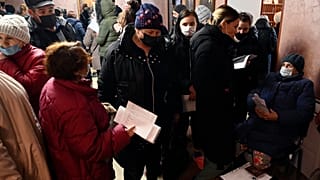 People from Donetsk gather to fill in documents after evacuating in the Rostov-on-Don region, near the border with Ukraine, Russia, Sunday, Feb. 20, 2022
