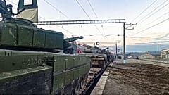 Feb. 15, 2022, Russian armored vehicles are loaded onto railway platforms after the end of military drills in South Russia.