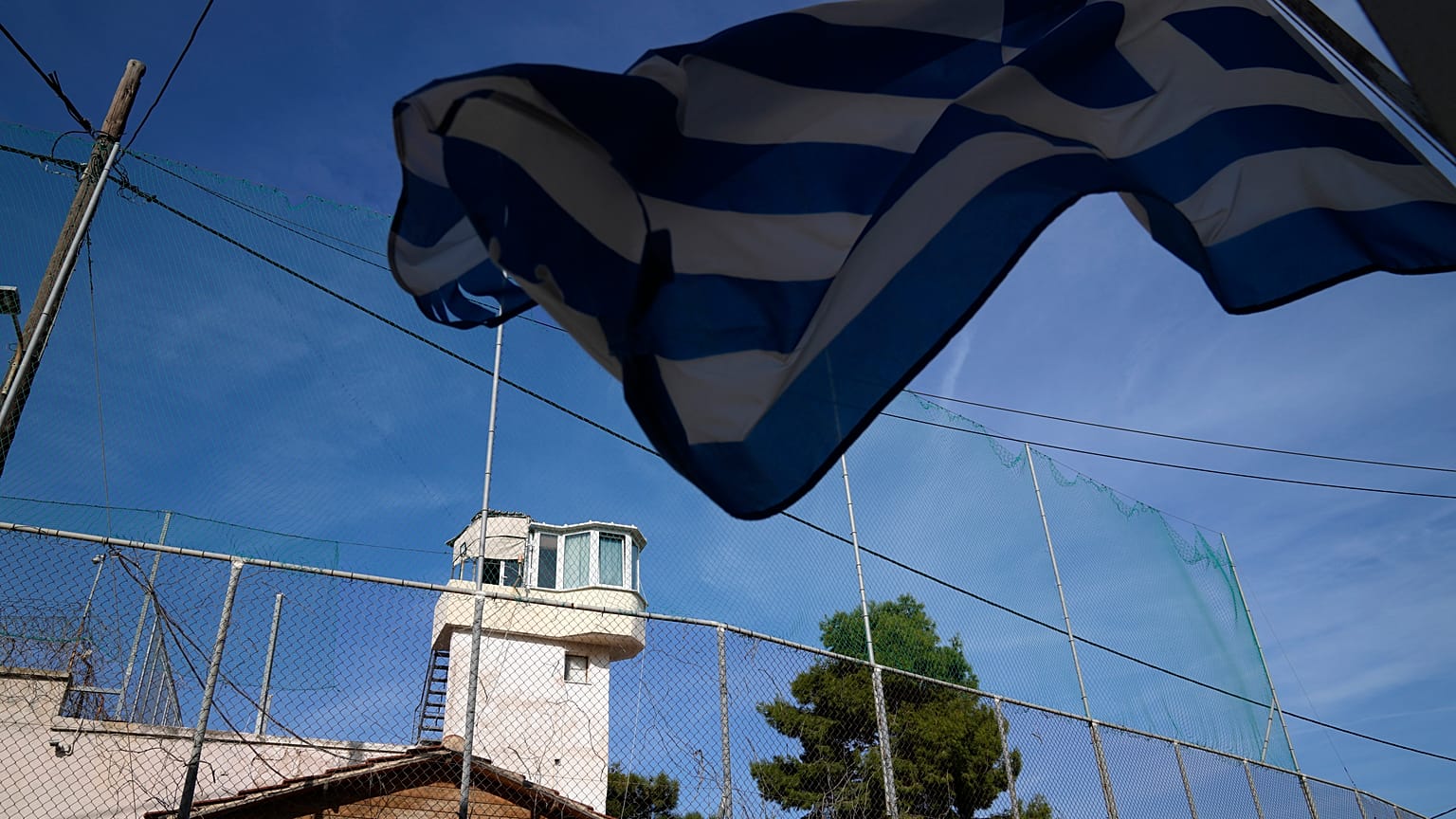 A Greek flag waves outside a prison on the northeastern Aegean island of Chios