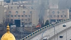 Smoke and flame rise near a military building after an apparent Russian strike in Kyiv