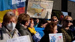 Ukrainians who live in Rome protest near the Russian Embassy in Rome, Thursday, Feb. 24, 2022. 