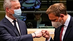 French Finance Minister Bruno Le Maire, left, greets German Finance Minister Christian Lindner during a meeting of eurogroup finance ministers 
