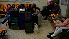 People from Ukraine, rest at a train station that was turned into an accommodation center in Przemysl, Poland