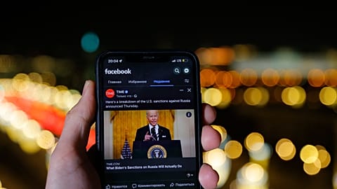 The app of Facebook showing U.S. President Joe Biden speaking, is viewed on an smartphone in Moscow, Russia, Friday, February 25, 2022.