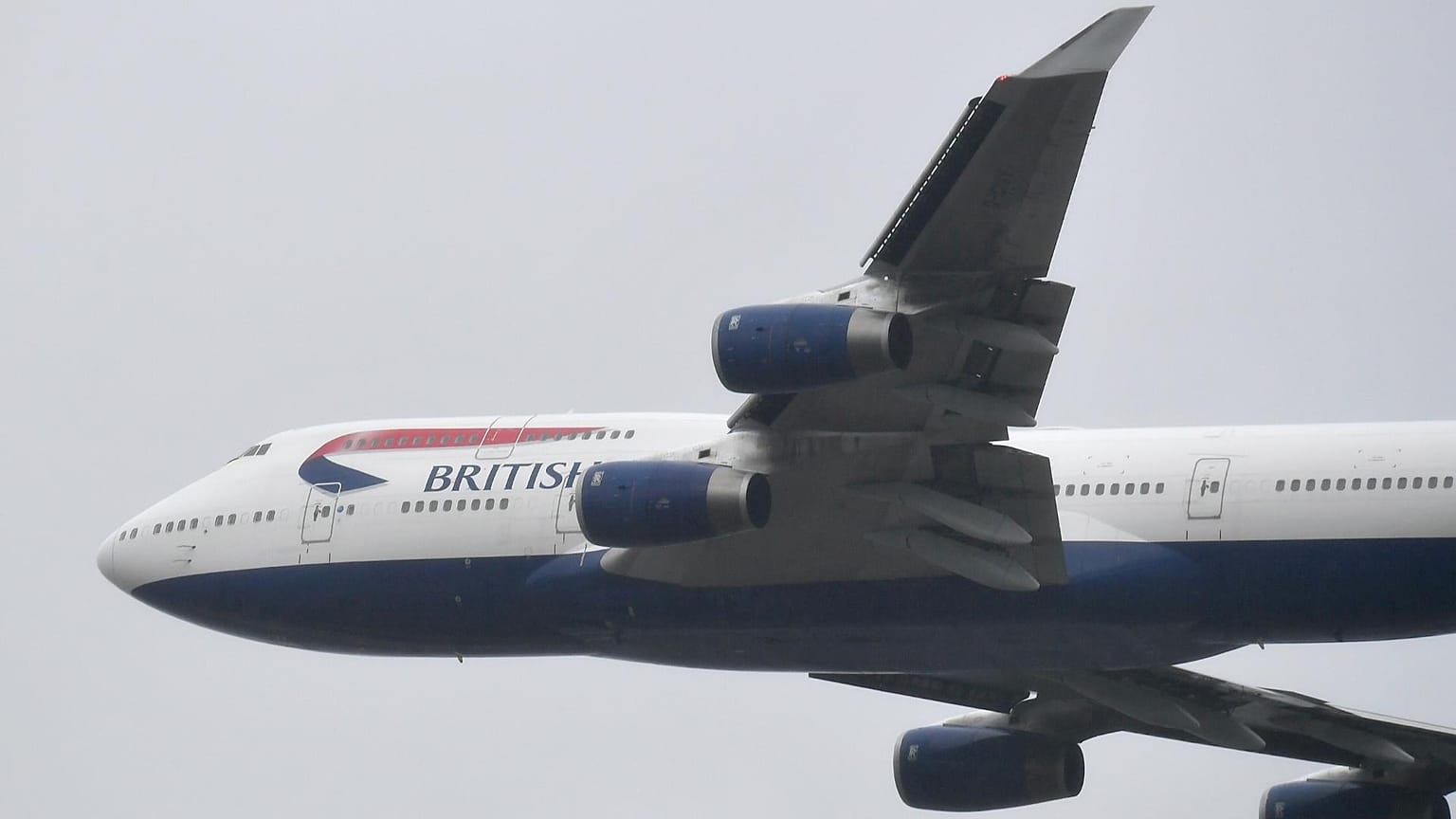 A British Airways Boeing 747 does a flypast over London Heathrow airport.