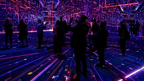 Visitors watch a projection at the TelcoDR booth during the Mobile World Congress 2021 in Barcelona, Spain, Tuesday, June, 29, 2021.