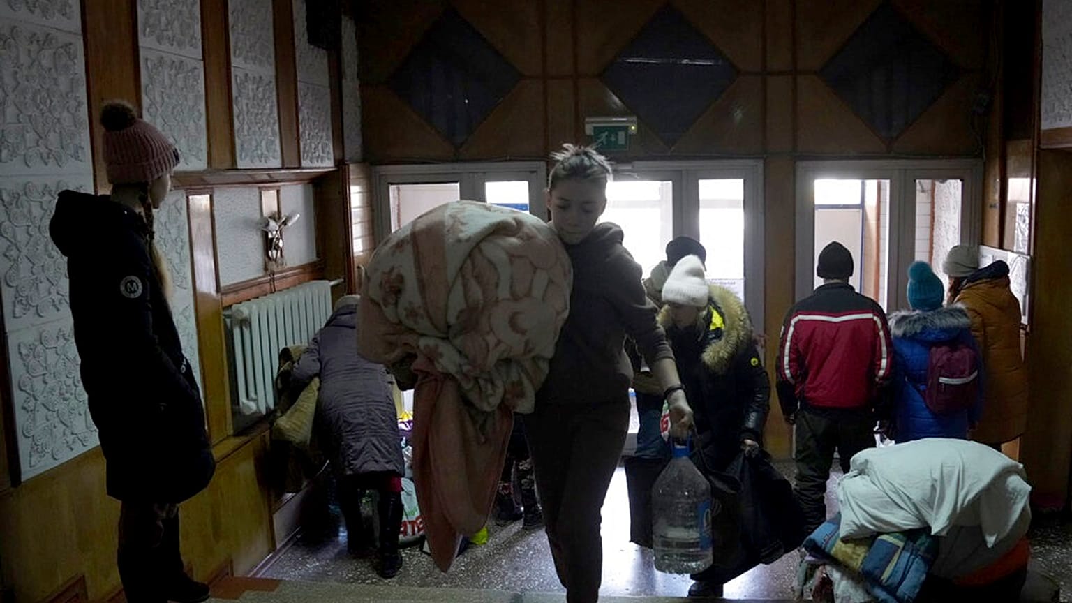 People take shelter inside a building in Mariupol, Ukraine