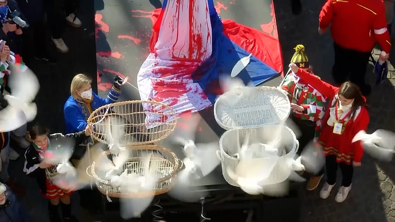 Doves released during a protest at the Cologne Carnival against the Russian attack