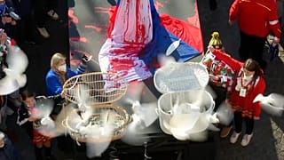 Doves released during a protest at the Cologne Carnival against the Russian attack