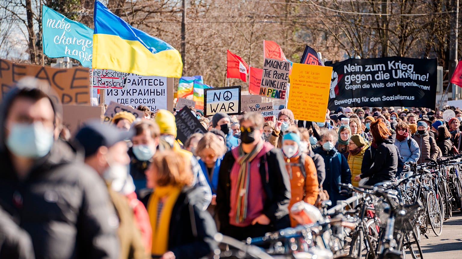Protestors take part in a demonstration against Russia's military intervention in Ukraine in Bern, Switzerland, Saturday, February 26, 2022.