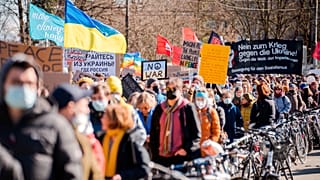 Protestors take part in a demonstration against Russia's military intervention in Ukraine in Bern, Switzerland, Saturday, February 26, 2022.