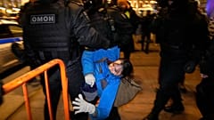 Police detain a demonstrator during an action against Russia's attack on Ukraine in St. Petersburg, Russia, Saturday, Feb. 26, 2022