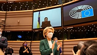 European Commission President Ursula von der Leyen applauds after an address by Ukraine's President Volodymyr Zelenskyy, via video link, during a session on Ukraine